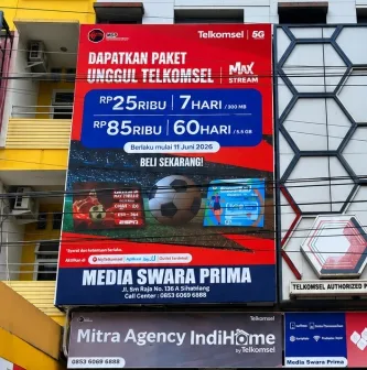 Signage gerai Mitra Telkomsel